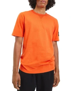 Calvin Klein Jeans Monologo Sleeve Badge Tee In Coral Orange